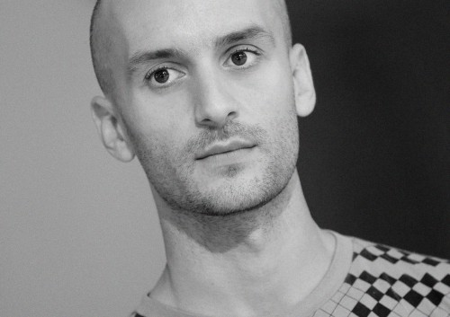 This image has an empty alt attribute; its file name is mikhail-karikis-portrait-web1-e1437400328993.jpg